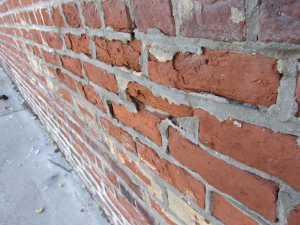 Example of improper repointing with portland cement causing historic brick to spall due to different compressive strengths. 